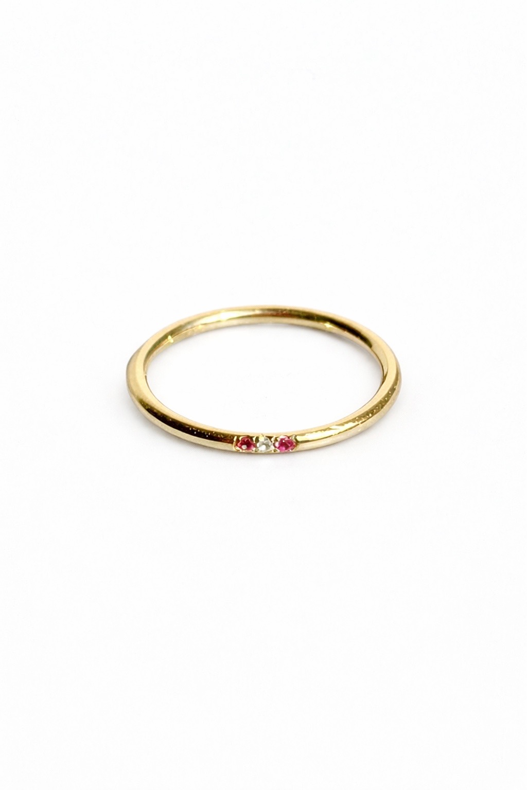 Bespoke gold band with pink sapphires and diamond